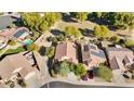 Aerial view showing house, pool, and surrounding neighborhood at 17713 N Larkspur Ln, Surprise, AZ 85374