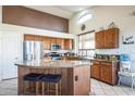 Spacious kitchen with granite countertops and stainless steel appliances at 18056 W Buena Vista Dr, Surprise, AZ 85374