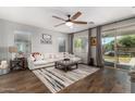 Spacious living room featuring hardwood floors and a cozy seating area at 19919 W Lincoln St, Buckeye, AZ 85326