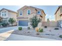 Two-story house with gray garage door and landscaping at 36085 W Prado St, Maricopa, AZ 85138