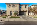 Two-story home with gray garage and walkway at 4124 E Toledo St, Gilbert, AZ 85295