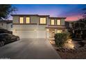 Two-story house with a three-car garage and landscaped front yard at 4360 E Sierrita Rd, San Tan Valley, AZ 85143