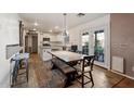 Eat-in kitchen with island, stainless steel appliances, and wood-look floors at 4360 E Sierrita Rd, San Tan Valley, AZ 85143