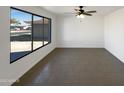 Spacious living area with tile floors and lots of natural light at 4511 W Cavalier Dr, Glendale, AZ 85301