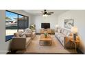 Bright living room featuring a comfy seating area and large window at 4511 W Cavalier Dr, Glendale, AZ 85301