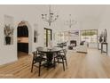 Stunning dining room with a dark wood table and chairs, and a built in bar at 5101 N Casa Blanca Dr # 301, Paradise Valley, AZ 85253