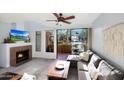 Cozy living room featuring a fireplace and sliding glass door leading to a patio at 5122 E Shea Blvd # 1100, Scottsdale, AZ 85254