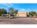 Attached garage with desert landscaping in background at 5743 E Windstone Trl, Cave Creek, AZ 85331