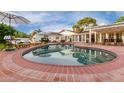 Inviting kidney-shaped pool with brick coping and lounge chairs at 5801 E Exeter Blvd, Phoenix, AZ 85018