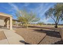 Landscaped backyard with view of golf course at 6307 S Palo Blanco Dr, Gold Canyon, AZ 85118