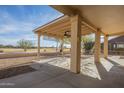 Covered patio with ceiling fan, offering a relaxing outdoor space at 6307 S Palo Blanco Dr, Gold Canyon, AZ 85118