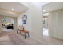 Bright entryway with a bench, artwork, and views into living room and bathroom at 6318 N 19Th St, Phoenix, AZ 85016