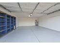 Garage interior with storage shelving and epoxy flooring at 6339 W Ironwood W Dr, Glendale, AZ 85302