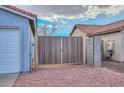 View of a brown wooden gate leading to the backyard at 6339 W Ironwood W Dr, Glendale, AZ 85302