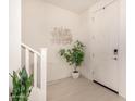 Bright entryway with white door and plant at 653 N Abalone Dr, Gilbert, AZ 85233