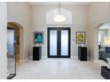 Elegant entryway with high ceilings, tiled floors, and double doors at 7878 E Gainey Ranch Rd # 3, Scottsdale, AZ 85258