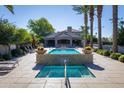 Resort-style pool and spa with lounge chairs and umbrellas at 7878 E Gainey Ranch Rd # 3, Scottsdale, AZ 85258