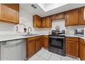 Modern kitchen with wood cabinets and stainless steel appliances at 832 W 14Th St, Tempe, AZ 85281