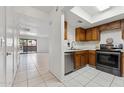 Bright kitchen featuring wood cabinets, stainless steel appliances, and tiled floors at 832 W 14Th St, Tempe, AZ 85281