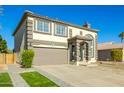 Two-story house with a brown garage door and landscaped yard at 11020 W Lane Ave, Glendale, AZ 85307