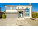 Two-story house with a brown garage door and landscaped yard at 11020 W Lane Ave, Glendale, AZ 85307