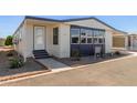 Mobile home showcases updated exterior with walkway at 11596 W Sierra Dawn Blvd # 109, Surprise, AZ 85378