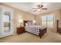 Cozy bedroom with wood furniture and plantation shutters at 1306 E Cecil Ct, Casa Grande, AZ 85122