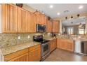 Spacious kitchen with granite countertops and wood cabinets at 1306 E Cecil Ct, Casa Grande, AZ 85122