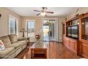 Bright living room with hardwood floors and sliding glass door at 1306 E Cecil Ct, Casa Grande, AZ 85122