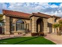 Two-story home with a three-car garage and manicured lawn at 13332 W Palo Verde Dr, Litchfield Park, AZ 85340