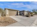 Eye-catching curb appeal with a welcoming front porch and landscaping at 1520 W Sonoqui Blvd, San Tan Valley, AZ 85140