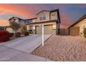 Two-story house with a large driveway and landscaping at 17152 W Grant St, Goodyear, AZ 85338