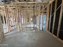 View of unfinished interior showing framing, plumbing, and a mounted bathtub unit at 22827 E Lords Way, Queen Creek, AZ 85142