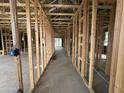 Unfinished interior showcasing the wooden framework and layout of the home at 22827 E Lords Way, Queen Creek, AZ 85142