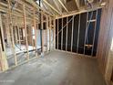 Unfinished interior view displaying framing, black insulation and visible plumbing lines at 22827 E Lords Way, Queen Creek, AZ 85142