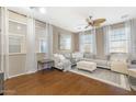 Bright and airy living room with hardwood floors and ample natural light at 3039 W Sand Flower Dr, Phoenix, AZ 85086