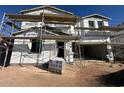 Unfinished two story house under construction with scaffolding at 32111 N Saddlehorn Dr, San Tan Valley, AZ 85140