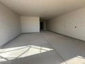 Unfinished garage interior with concrete floor and drywall at 32111 N Saddlehorn Dr, San Tan Valley, AZ 85140