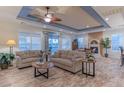 Spacious living room with two sofas, a coffee table, and a fireplace at 3604 N 162Nd Ave, Goodyear, AZ 85395