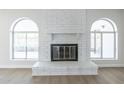 White brick fireplace with arched windows at 4202 W Wood Dr, Phoenix, AZ 85029