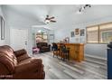 Cozy game room featuring a wet bar and comfortable seating at 45579 W Rainbow Dr, Maricopa, AZ 85139