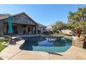 Inviting kidney shaped pool with flagstone decking, perfect for relaxation at 5432 W Fallen Leaf Ln, Glendale, AZ 85310