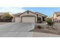 House exterior with a two-car garage and driveway at 6910 S 26Th Ln, Phoenix, AZ 85041