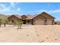 Beautiful desert home with a three-car garage and mountain views at 8474 W Switchback Trl, Casa Grande, AZ 85194