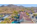 Backyards with refreshing pools, desert landscaping, and beautiful mountain views in the distance at 914 E Ross Ave, Phoenix, AZ 85024