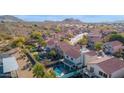 Aerial view of homes with refreshing pools, landscaped yards, and covered patios at 914 E Ross Ave, Phoenix, AZ 85024