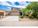 Two-story house with a two-car garage and landscaped yard at 1081 W Danish Red Trl, San Tan Valley, AZ 85143