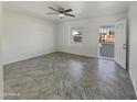 Open living area showcasing tile flooring and neutral colors at 130 N 95Th Pl, Mesa, AZ 85207