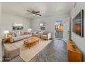 Bright living room featuring tile floors and modern furniture at 130 N 95Th Pl, Mesa, AZ 85207