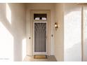 Front door with security screen and welcome mat at 15506 W Skyview Way, Surprise, AZ 85374